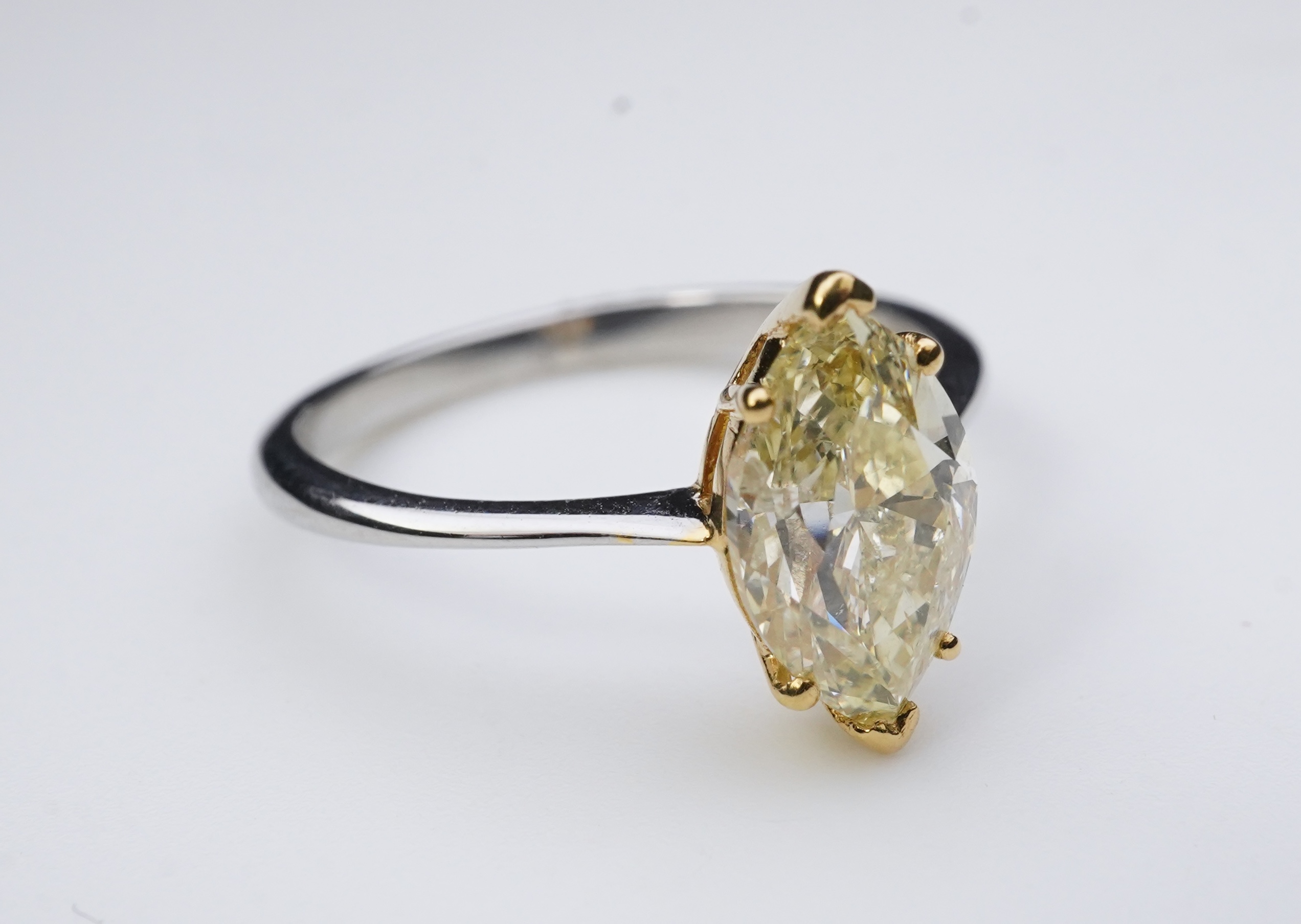 A yellow diamond solitaire ring